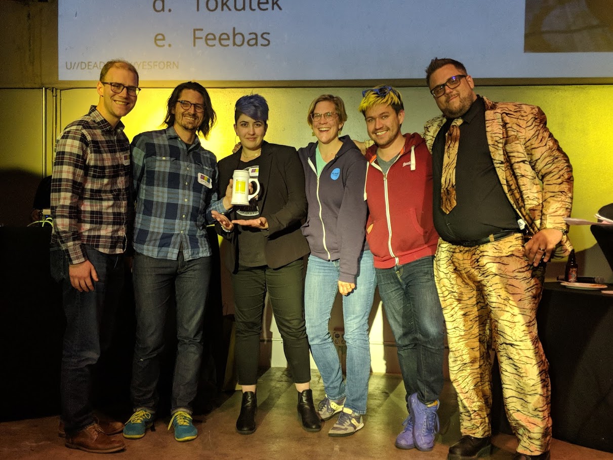 Our 2nd place team, Team Planet, on-stage with our emcee, CooperQ.