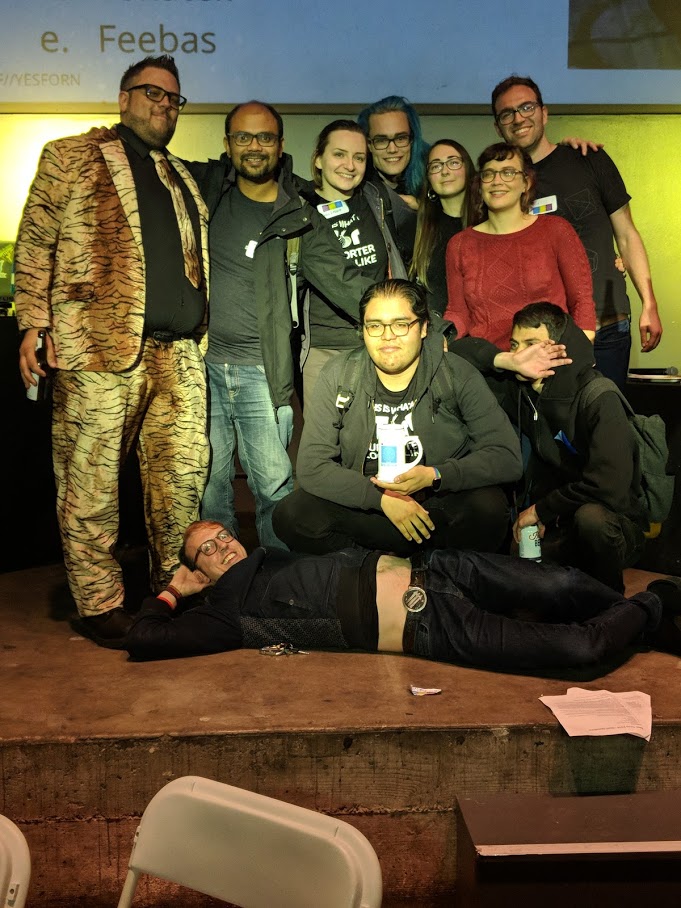 Our 3rd place team, Trash Cats, on-stage with our emcee, CooperQ.